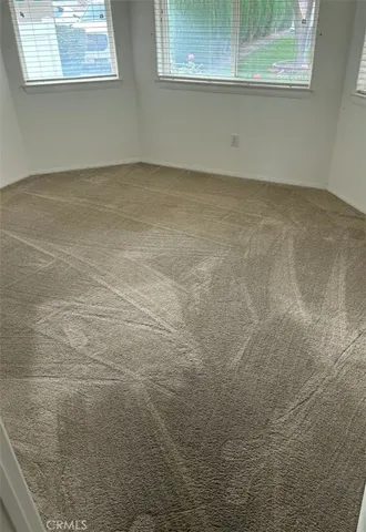 a view of a livingroom with furniture and a fireplace