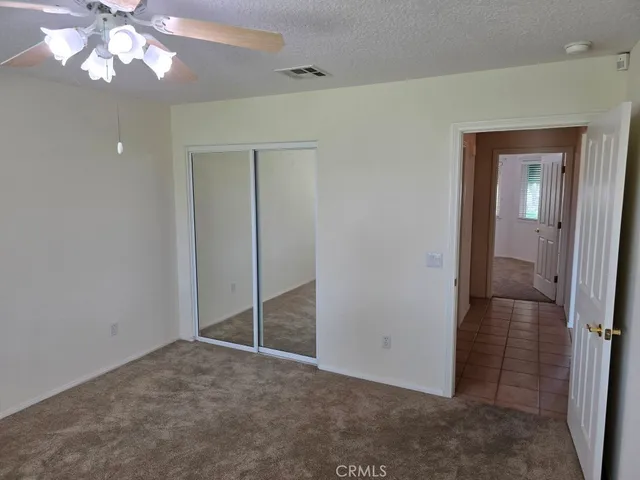 a view of a kitchen with a sink and a chandelier