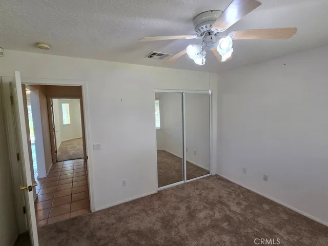 a view of a dining room with furniture and window