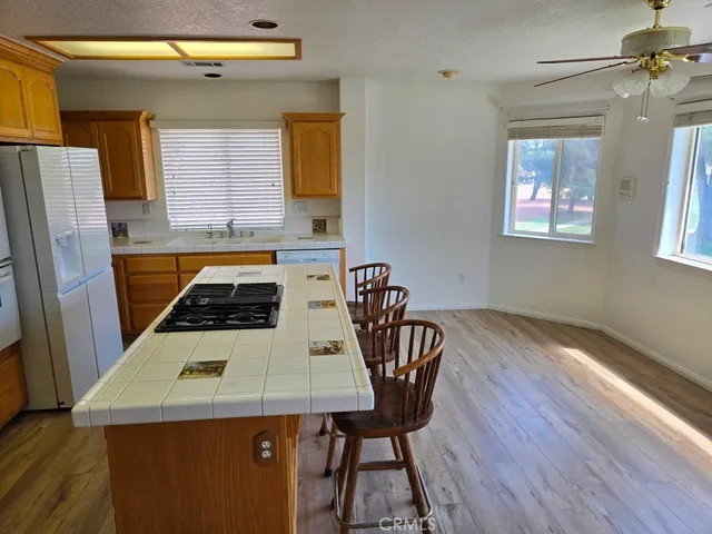 a room with a fireplace a chandelier and a window