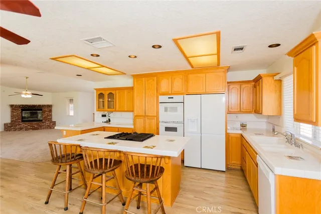 an empty room with fireplace and windows