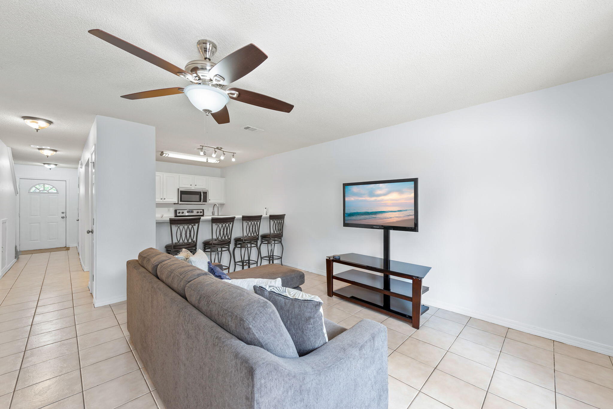 498 Keystone Road Mary Esther, FL 32569 - Photo 1 of 21 a living room with furniture and a ceiling fan