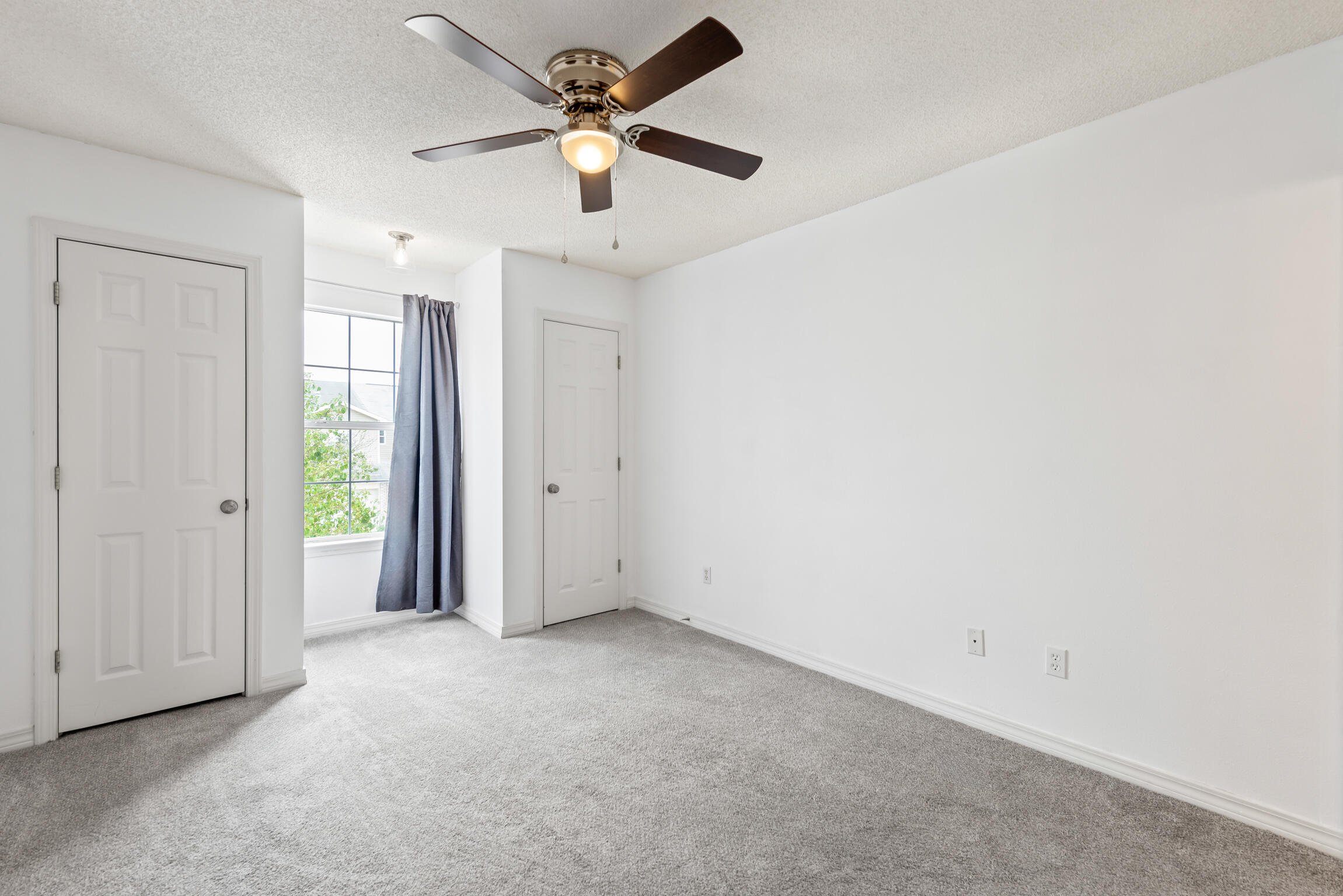 498 Keystone Road Mary Esther, FL 32569 - Photo 12 of 21 an empty room with a ceiling fan and a window