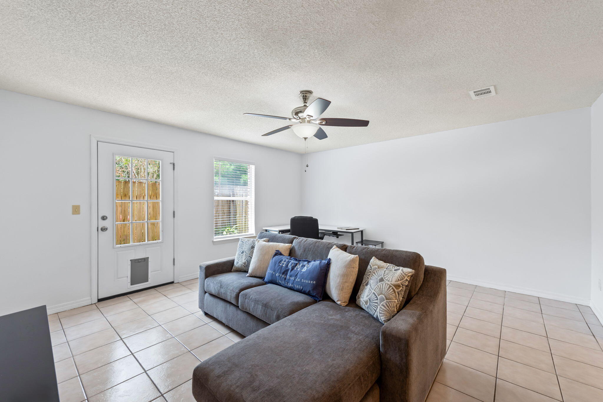 498 Keystone Road Mary Esther, FL 32569 - Photo 4 of 21 a living room with furniture and a window