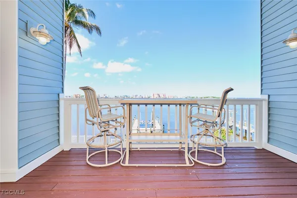 a view of a chair and table in the balcony