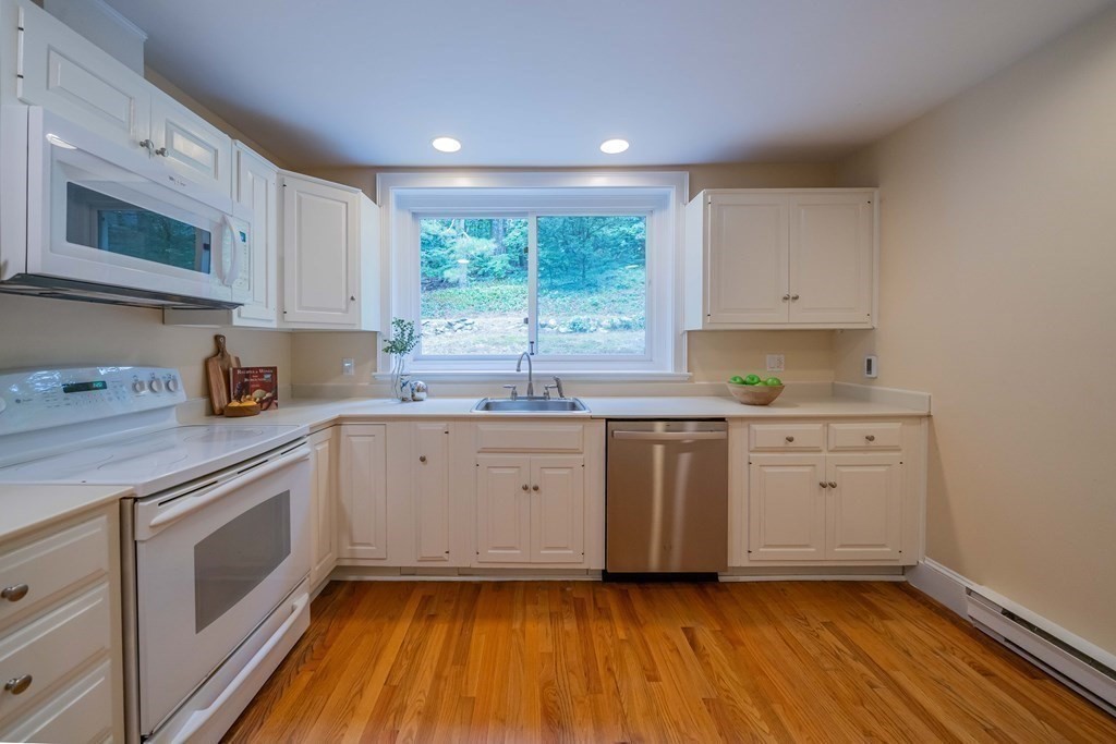 11 Wachusett Drive Lexington, MA 02421 - Photo 20 of 42 a kitchen with sink cabinets and window