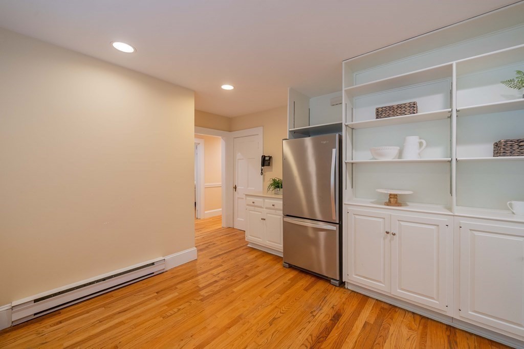 11 Wachusett Drive Lexington, MA 02421 - Photo 21 of 42 a view of a refrigerator in kitchen and wooden floor