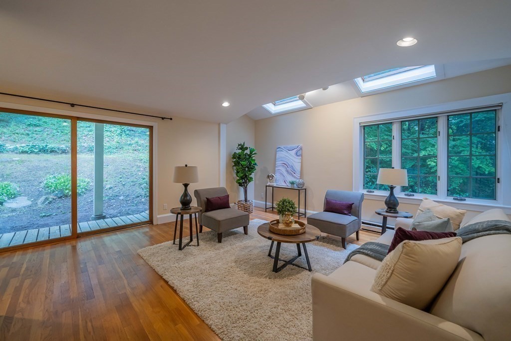 11 Wachusett Drive Lexington, MA 02421 - Photo 25 of 42 a living room with furniture and a large window