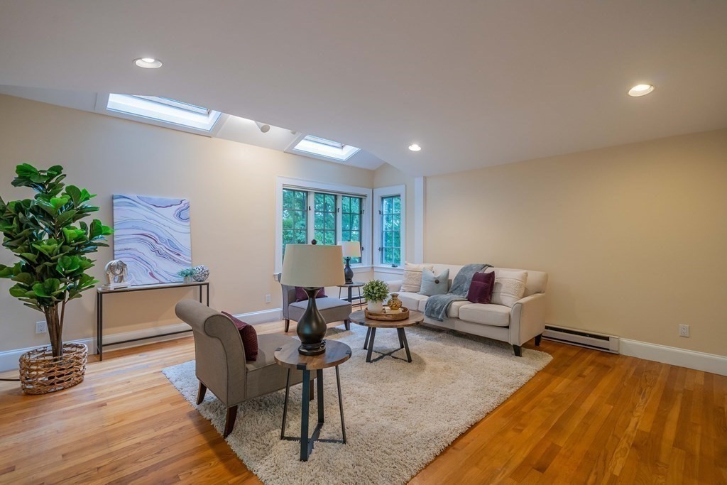 11 Wachusett Drive Lexington, MA 02421 - Photo 27 of 42 a living room with furniture and a potted plant
