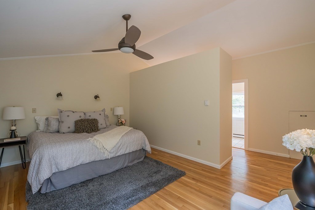 11 Wachusett Drive Lexington, MA 02421 - Photo 29 of 42 a bedroom with a bed and wooden floor