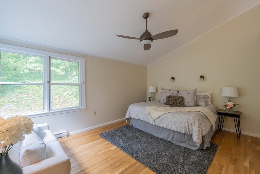 11 Wachusett Drive Lexington, MA 02421 - Photo 30 of 42 a bedroom with a bed and wooden floor