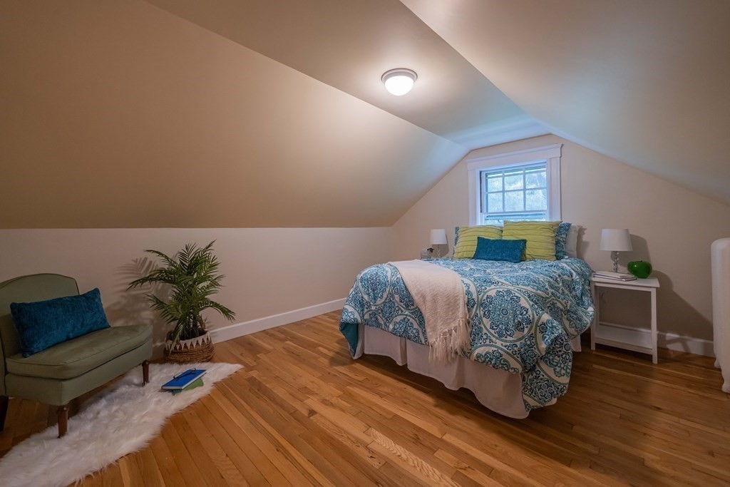 11 Wachusett Drive Lexington, MA 02421 - Photo 40 of 42 a bedroom with a bed table and a couch