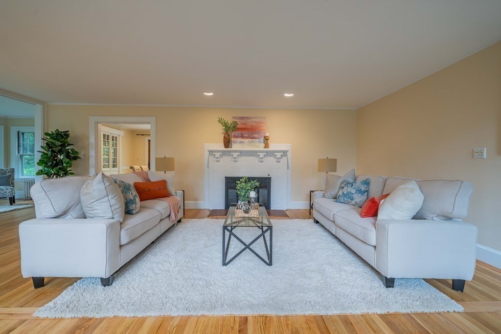 11 Wachusett Drive Lexington, MA 02421 - Photo 6 of 42 a living room with furniture and a fireplace