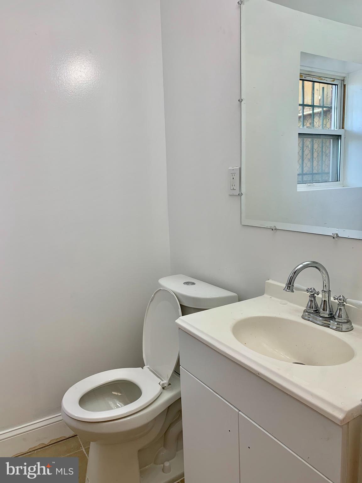 3542 Lyndale Avenue Baltimore, MD 21213 - Photo 11 of 12 a bathroom with a sink and a toilet