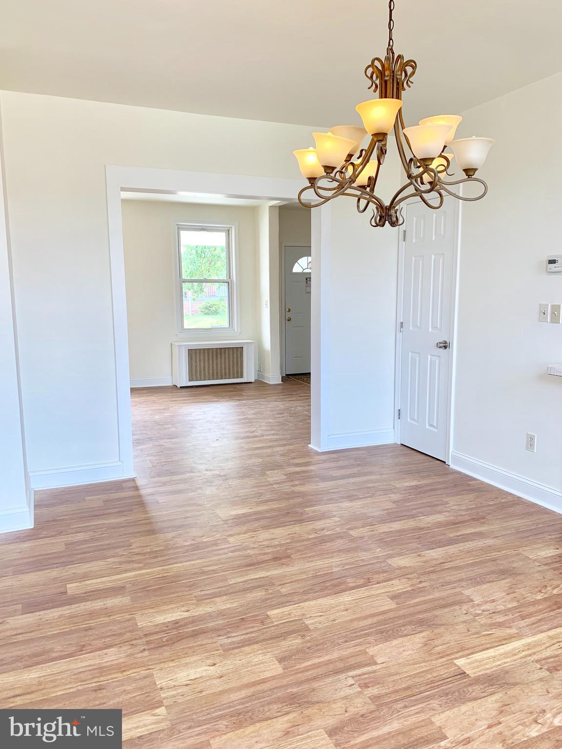 3542 Lyndale Avenue Baltimore, MD 21213 - Photo 3 of 12 a view of a livingroom with a chandelier
