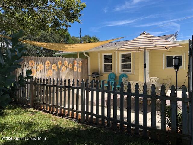 145 Atlantic Avenue Indialantic, FL 32903 - Photo 12 of 13 a front view of a house with a garden
