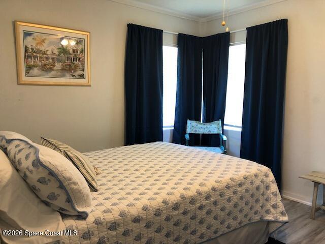 145 Atlantic Avenue Indialantic, FL 32903 - Photo 13 of 13 a bedroom with a bed and a window