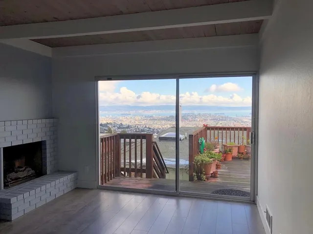 a view of a living room and a floor to ceiling window