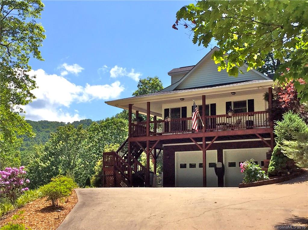 660 Edwards Cove Road, Unit 1 Waynesville, NC 28786 - Photo 1 of 24 a house view with a garden space