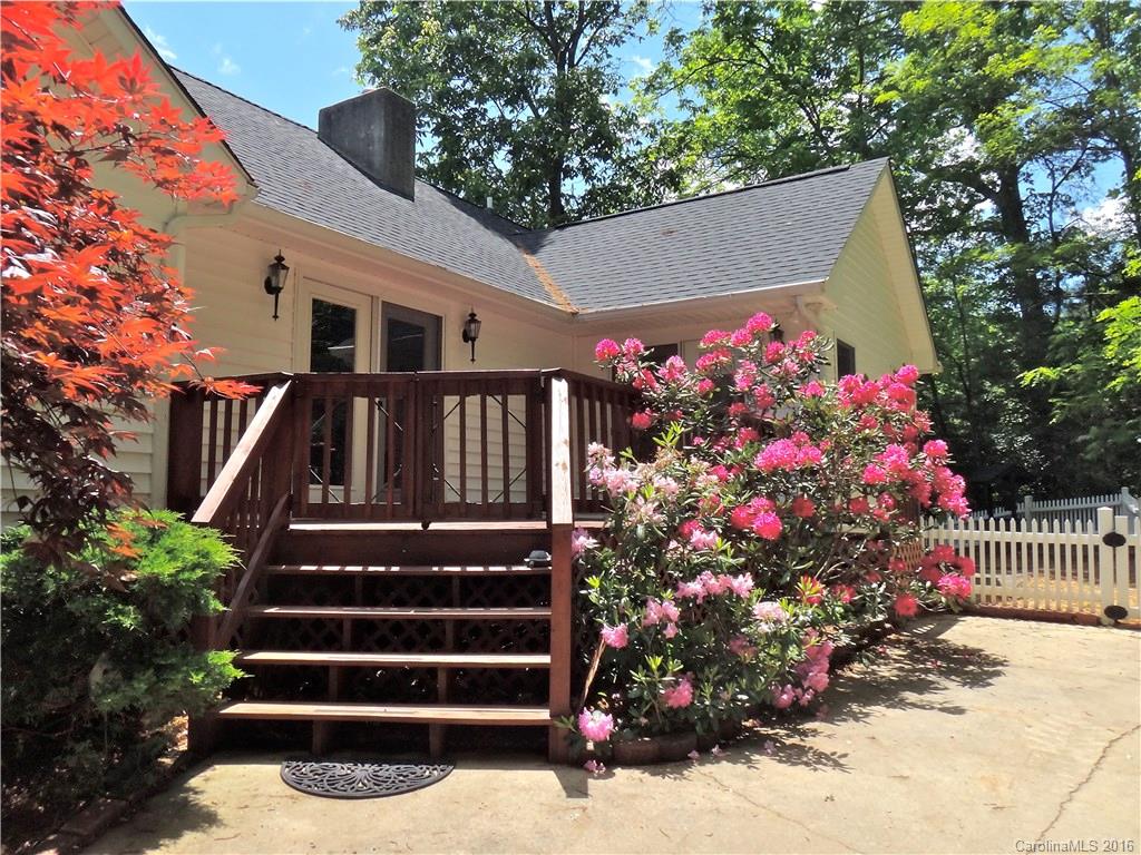 660 Edwards Cove Road, Unit 1 Waynesville, NC 28786 - Photo 2 of 24 a front view of building with flowers