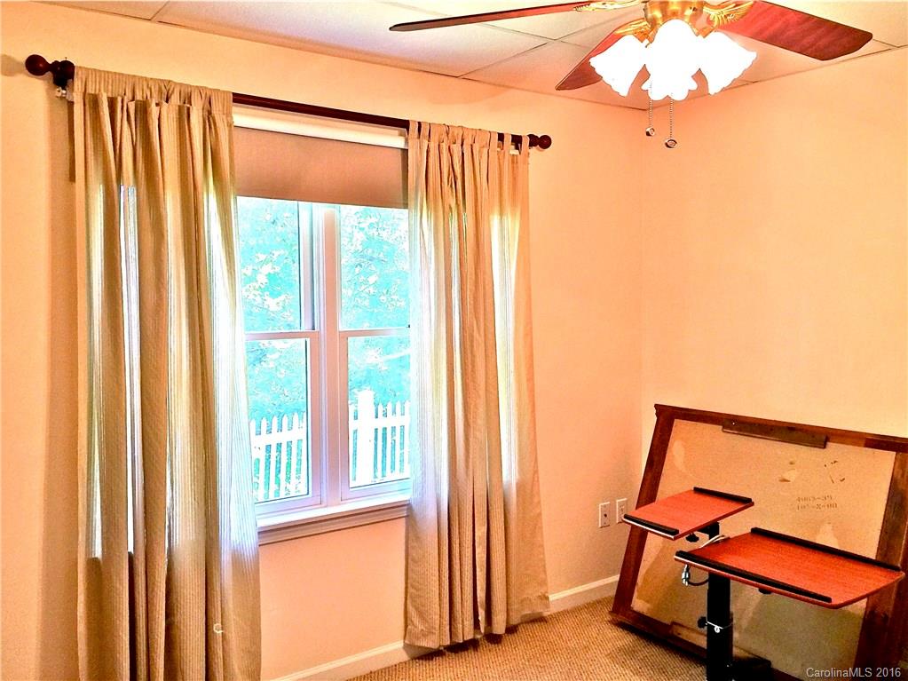 660 Edwards Cove Road, Unit 1 Waynesville, NC 28786 - Photo 18 of 24 a view of a room with gym equipment