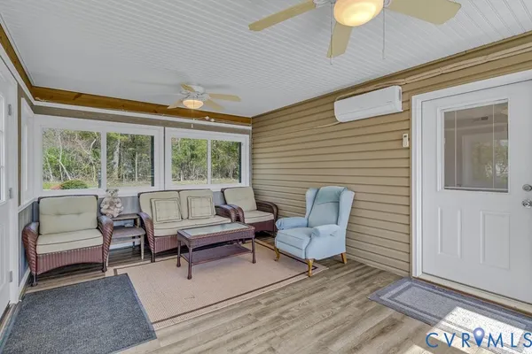 a bedroom with a bed and a lamp on dresser