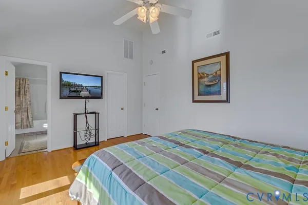 an aerial view of a house with a yard and lake view