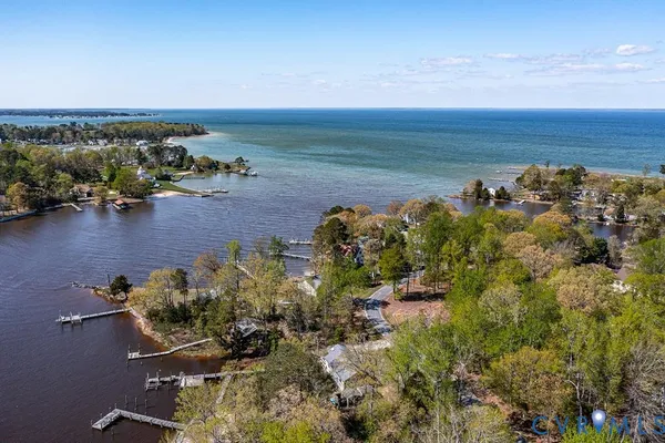 a view of house with a chairs and table in a patio