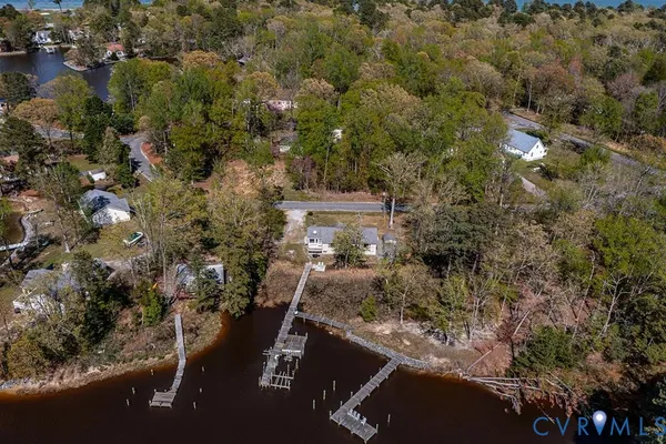 a view of a balcony with wooden floor and lake view