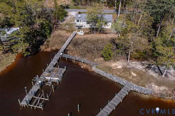 an aerial view of a house with a big yard