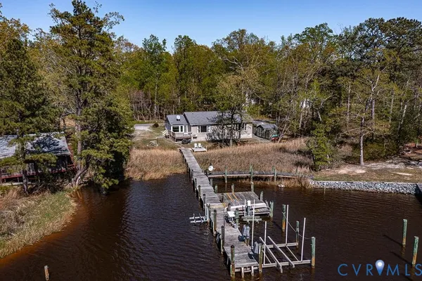 a view of a lake with a house in the background