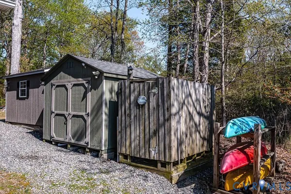 an aerial view of a house with a lake view