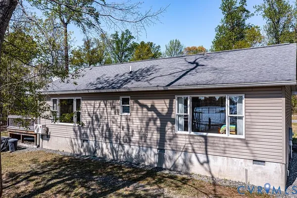 an aerial view of a house with a ocean view