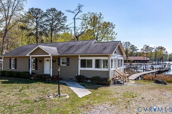 an aerial view of a house with a lake view