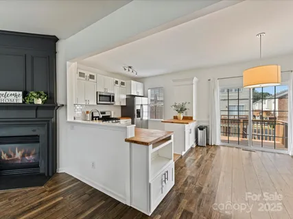 a kitchen with a sink stove and refrigerator