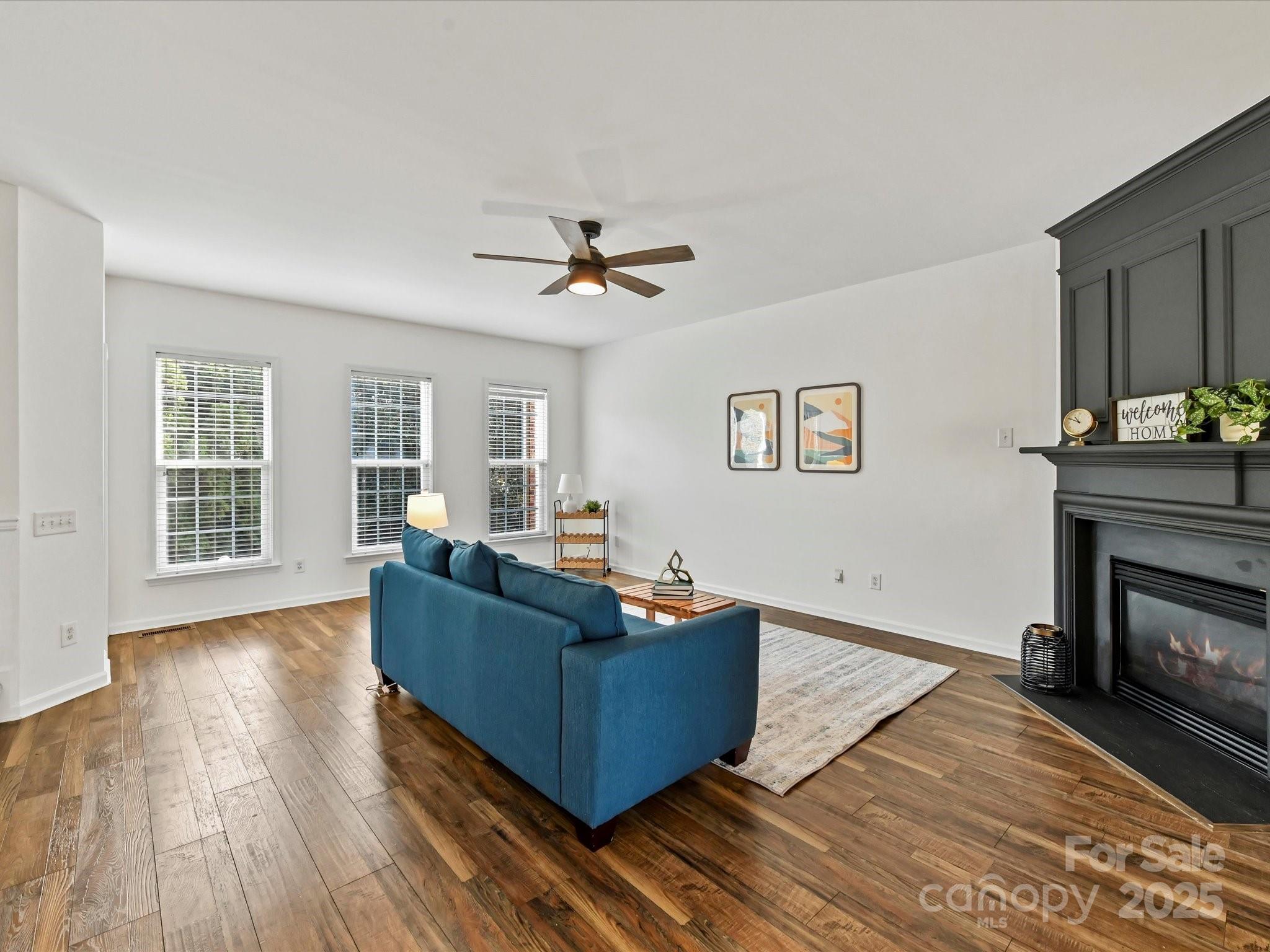 14130 Fitzroy Lane Charlotte, NC 28277 - Photo 12 of 24 a living room with furniture and a fireplace