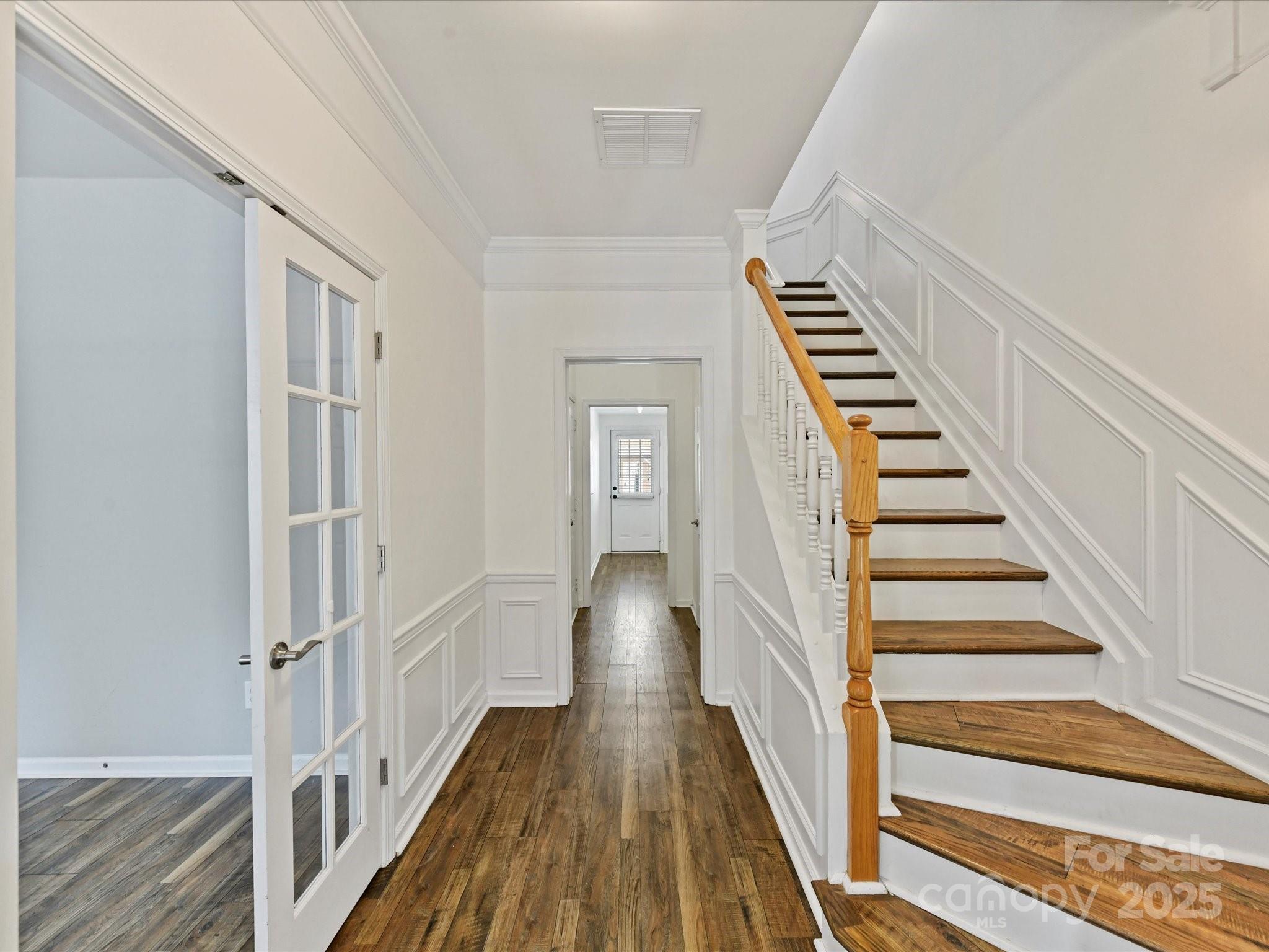 14130 Fitzroy Lane Charlotte, NC 28277 - Photo 4 of 24 a view of a hallway with wooden floor and entryway