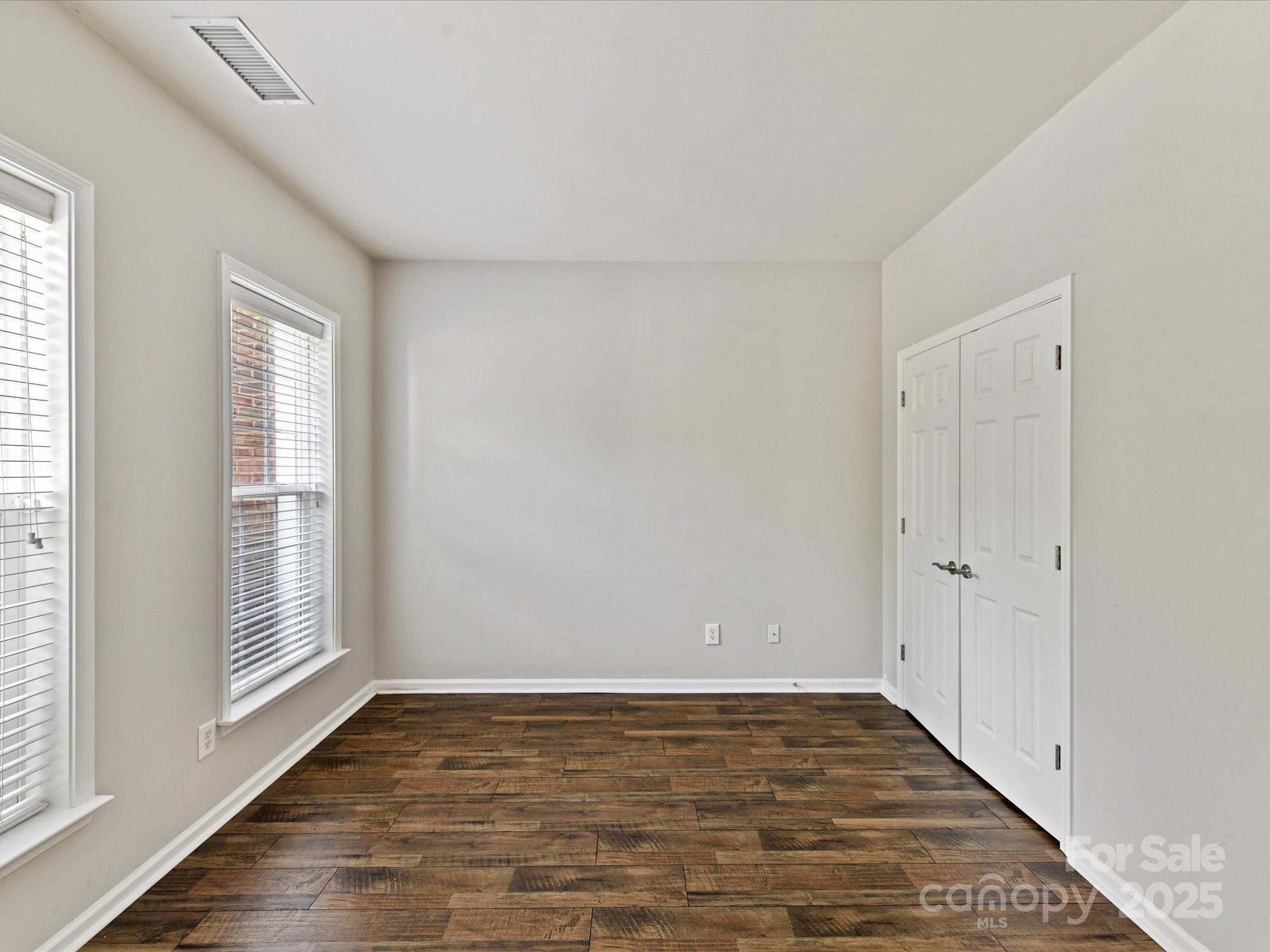 14130 Fitzroy Lane Charlotte, NC 28277 - Photo 5 of 24 a view of an empty room with wooden floor and a window