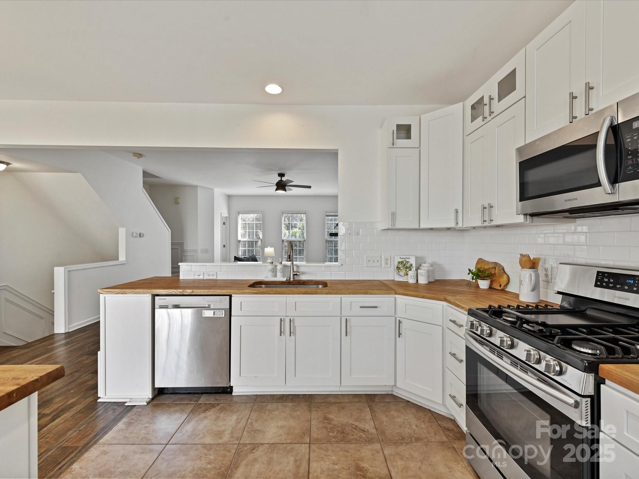 14130 Fitzroy Lane Charlotte, NC 28277 - Photo 10 of 24 a kitchen with stainless steel appliances granite countertop a stove and a sink