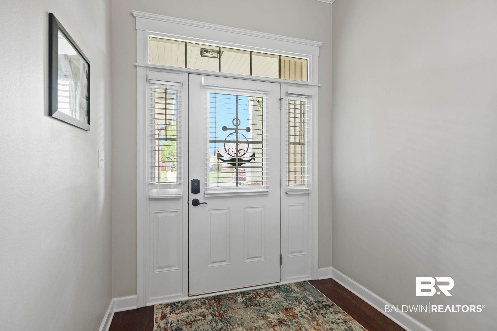 9177 Labrador Trail Theodore, AL 36582 - Photo 3 of 24 Entryway featuring dark wood finished floors and baseboards