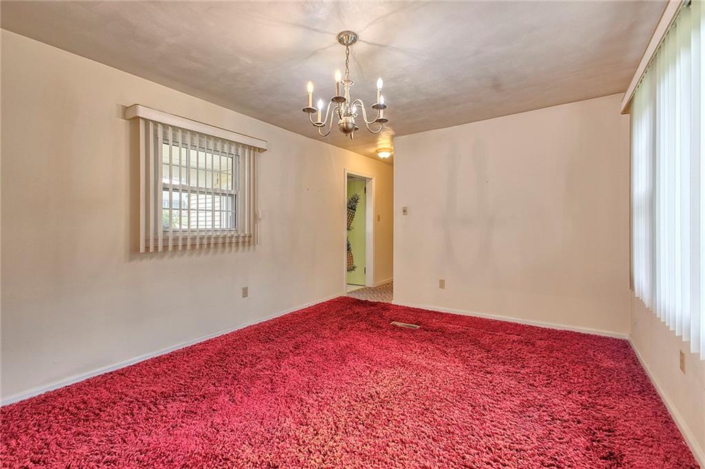 2117 Ridge Road Greensburg, PA 15601 - Photo 14 of 38 a view of empty room with window and wooden floor