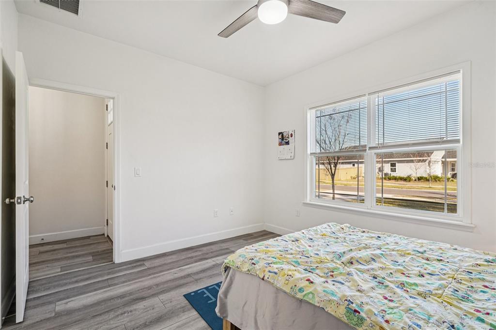6657 Southwest 15 Place Gainesville, FL 32607 - Photo 17 of 23 a bedroom with a bed and a window