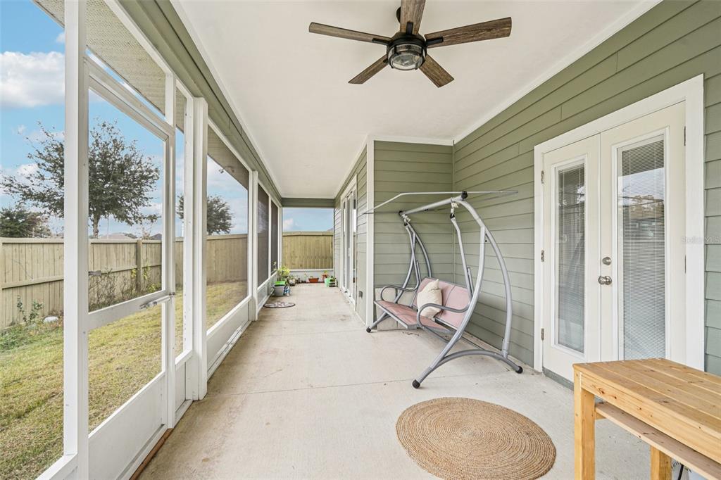 6657 Southwest 15 Place Gainesville, FL 32607 - Photo 20 of 23 a balcony with table and chairs