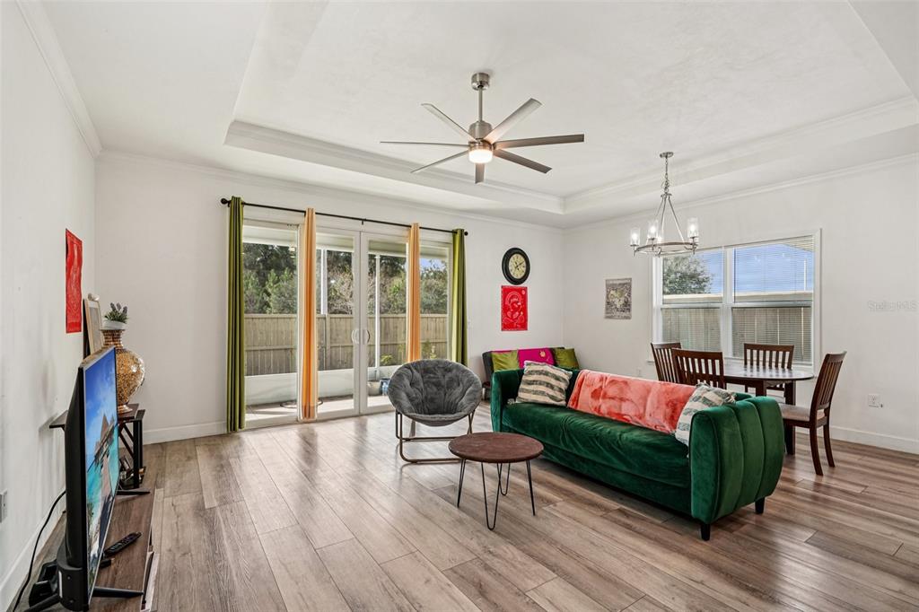 6657 Southwest 15 Place Gainesville, FL 32607 - Photo 8 of 23 a living room with furniture and a wooden floor