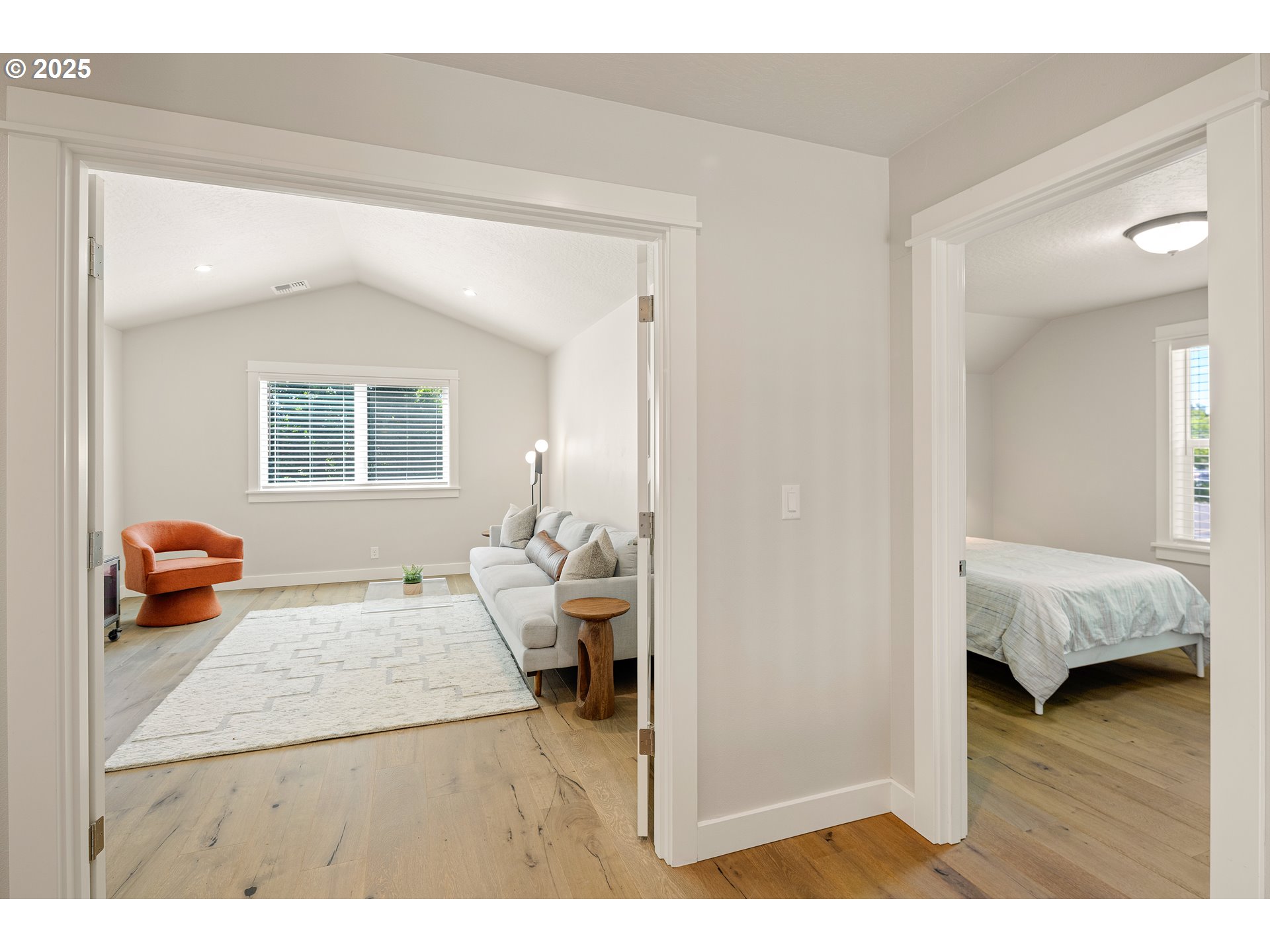 1408 Taylor Street Eugene, OR 97402 - Photo 27 of 43 a bedroom with a bed and wooden floor