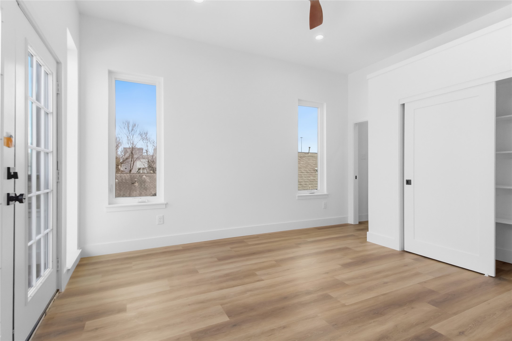 5614 Larkin Street, Unit D Houston, TX 77007 - Photo 11 of 16 a view of an empty room with wooden floor and a window
