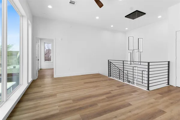 a view of staircase with white walls