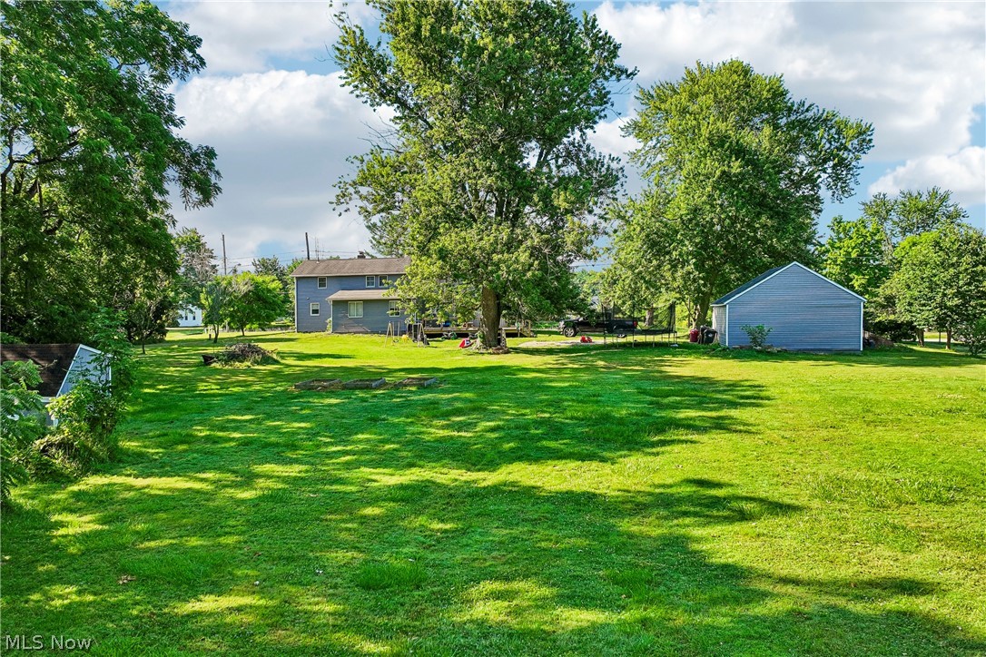 6711 Norwalk Road Medina, OH 44256 - Photo 39 of 46 Backyard looking at the back of the house and garage