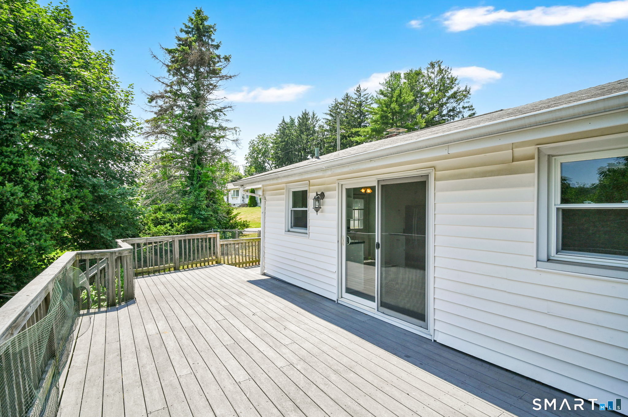 7 Rogers Drive Meriden, CT 06450 - Photo 6 of 40 a view of a deck with wooden floor and fence with a wooden fence