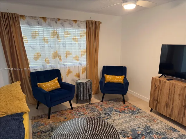 a couch sitting in a room next to a window